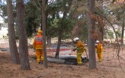 Crews extinguish a fire at Brukunga